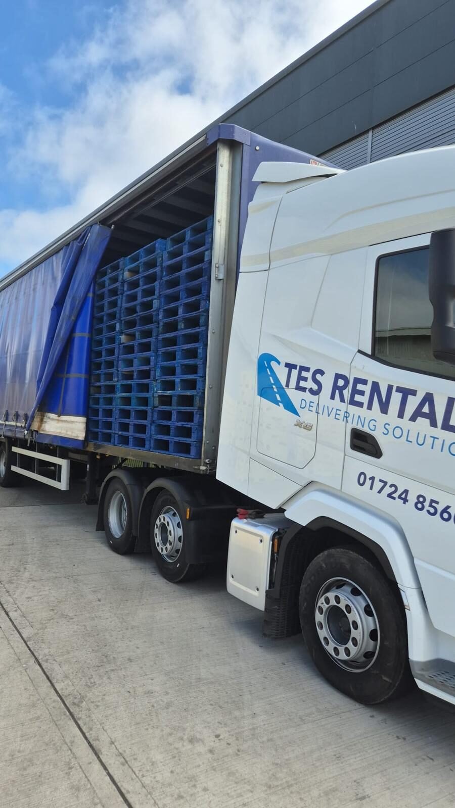 TES truck loading pallets at the depot
